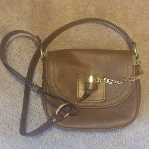 Michael Kors saddle bag from retail, not outlet.